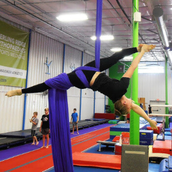 Aerial Silks Student works on her flexibility in class.